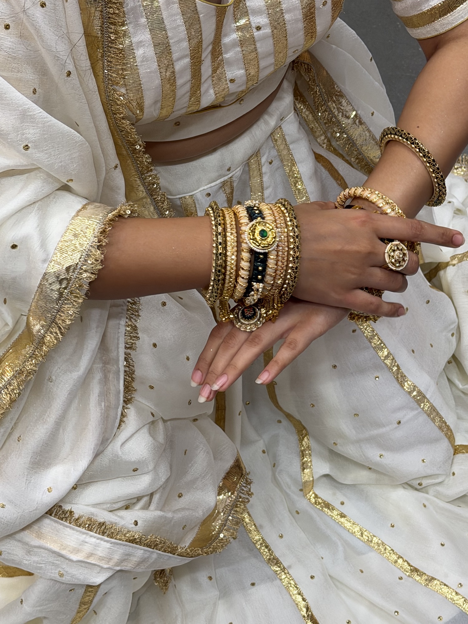 Emerald and ivory bangles styled across a complete festive look