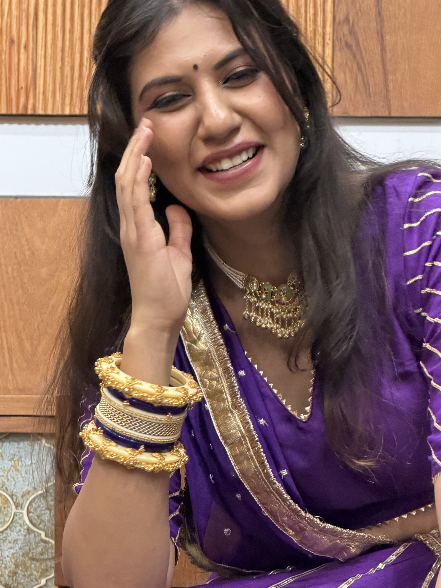 Necklace, earrings and bangles styled with a purple festive outfit